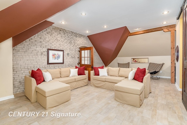 105 Parkwood Ct, Bay City, MI 48706 - living room with brick wall, baseboards, and lofted ceiling