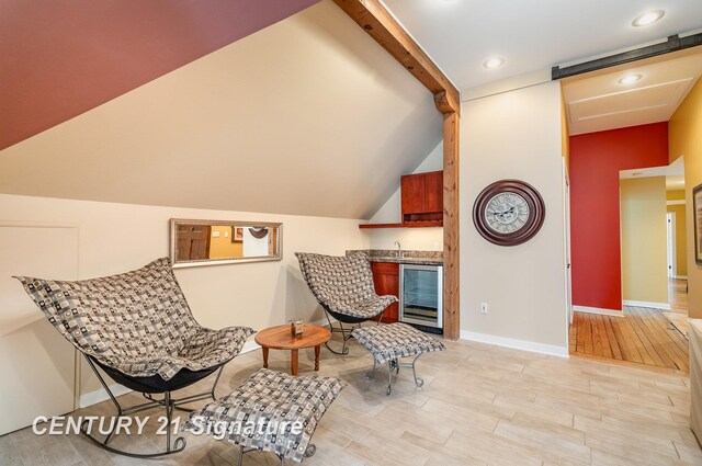 105 Parkwood Ct, Bay City, MI 48706 - living area with light wood-type flooring, baseboards, lofted ceiling with beams, recessed lighting, and beverage cooler