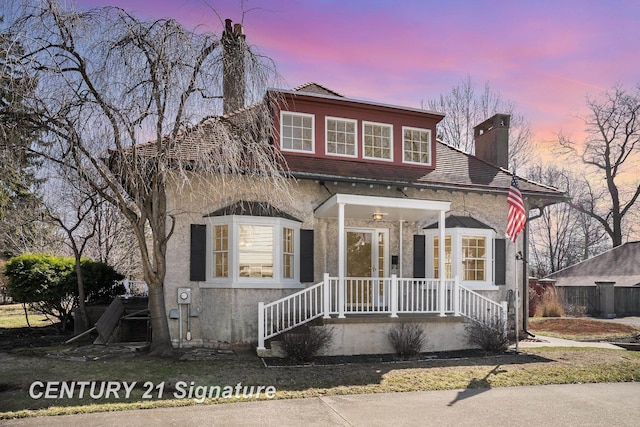 105 Parkwood Ct, Bay City, MI 48706 - view of front of house featuring a chimney and stucco siding