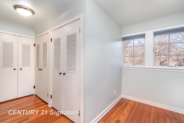 105 Parkwood Ct, Bay City, MI 48706 - hallway featuring baseboards and wood finished floors