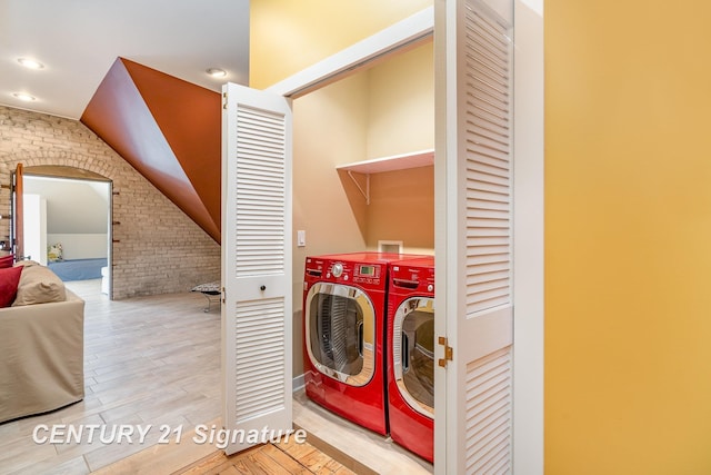 105 Parkwood Ct, Bay City, MI 48706 - washroom with brick wall, laundry area, recessed lighting, wood finished floors, and washing machine and dryer