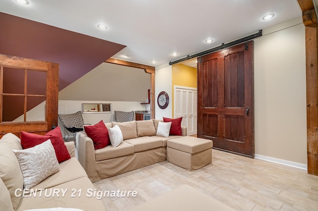 105 Parkwood Ct, Bay City, MI 48706 - living room featuring light wood-style flooring, baseboards, recessed lighting, and a barn door