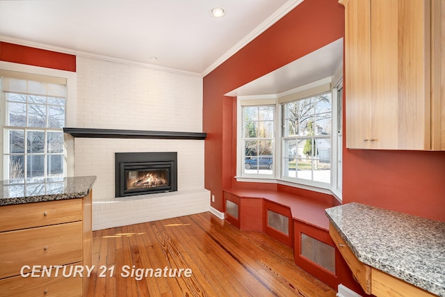105 Parkwood Ct, Bay City, MI 48706 - living area featuring crown molding, baseboards, hardwood / wood-style floors, and a brick fireplace