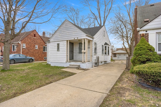 7416 Heyden St, Detroit, MI 48228 - view of front of home with concrete driveway and a front yard