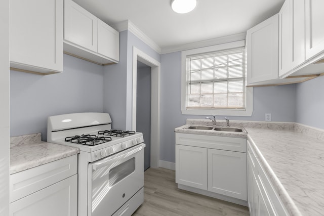 7416 Heyden St, Detroit, MI 48228 - kitchen with crown molding, white cabinetry, a sink, and white gas stove