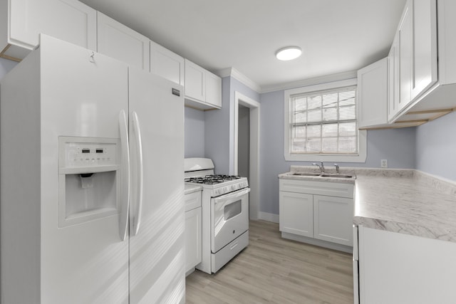 7416 Heyden St, Detroit, MI 48228 - kitchen featuring white cabinets, a sink, ornamental molding, light countertops, and white appliances