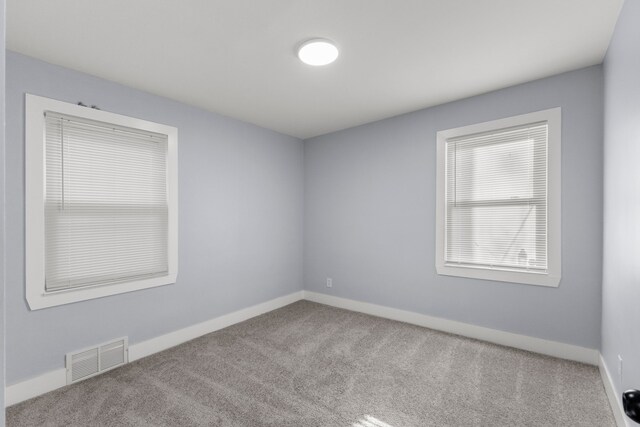 7416 Heyden St, Detroit, MI 48228 - spare room with visible vents, baseboards, and carpet floors