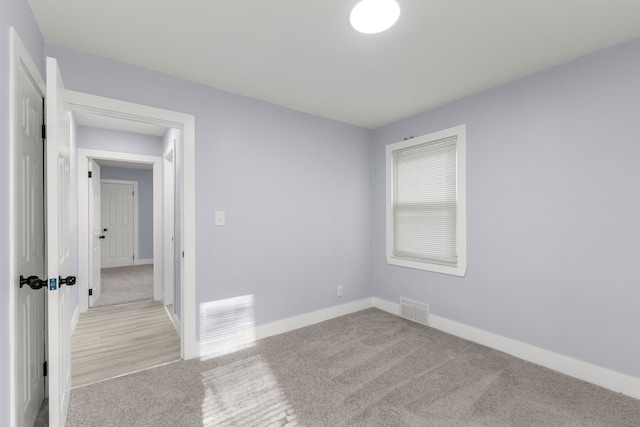 7416 Heyden St, Detroit, MI 48228 - unfurnished bedroom featuring light carpet, baseboards, and visible vents