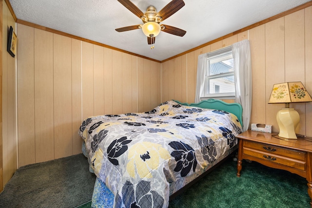 carpeted bedroom featuring wooden walls, crown molding, and a ceiling fan
