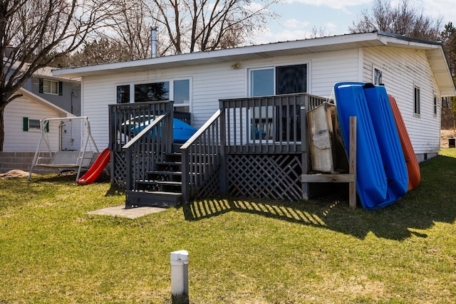 back of property featuring a yard and a deck
