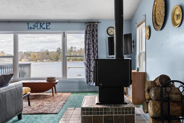 carpeted living area with baseboards