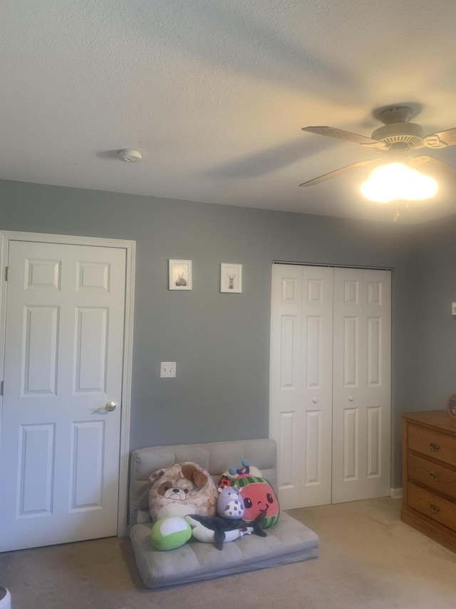 133 Bingham Dr, Brooklyn, MI 49230 - bedroom with light colored carpet, a closet, ceiling fan, and a textured ceiling