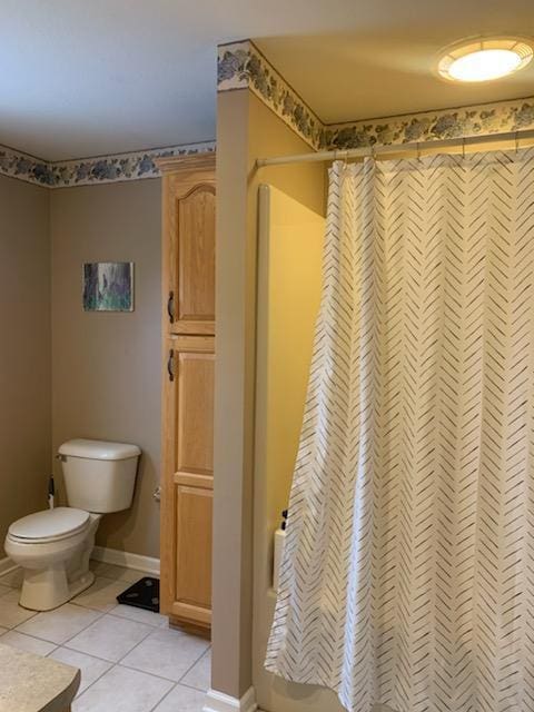 133 Bingham Dr, Brooklyn, MI 49230 - full bathroom with tile patterned floors, a shower with curtain, baseboards, and toilet