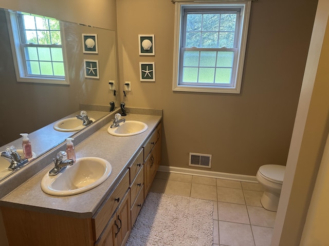 133 Bingham Dr, Brooklyn, MI 49230 - bathroom with tile patterned flooring, baseboards, toilet, and double vanity