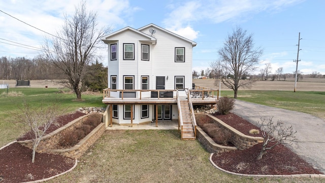 14204 Northmoor Dr, Cement City, MI 49233 - rear view of house with a wooden deck, a yard, stairway, a patio, and driveway
