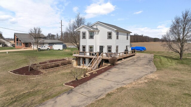 14204 Northmoor Dr, Cement City, MI 49233 - view of property exterior with a yard, driveway, a deck, and stairs
