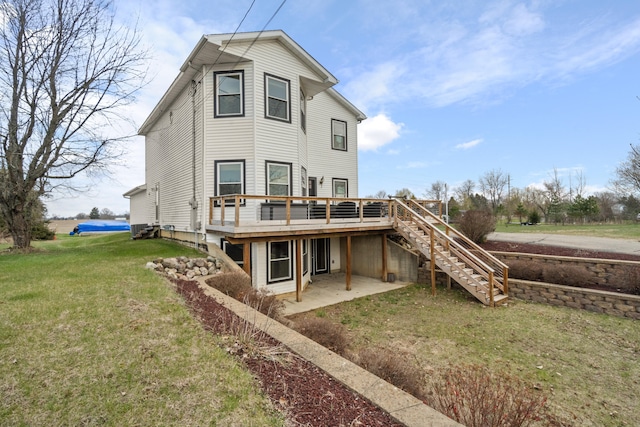 14204 Northmoor Dr, Cement City, MI 49233 - rear view of property featuring a yard, a wooden deck, a patio area, and stairs