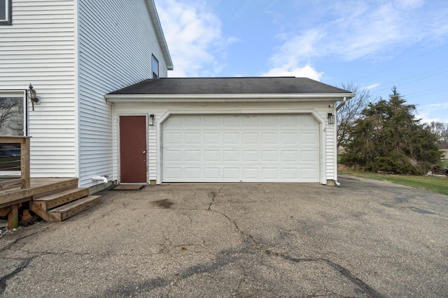 14204 Northmoor Dr, Cement City, MI 49233 - garage featuring driveway