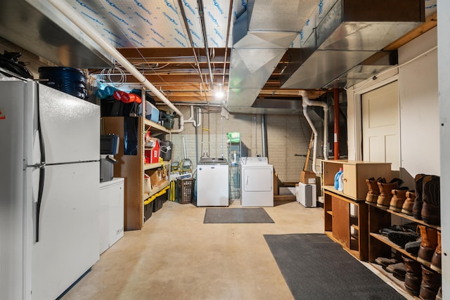 14204 Northmoor Dr, Cement City, MI 49233 - unfinished basement with freestanding refrigerator and washing machine and dryer