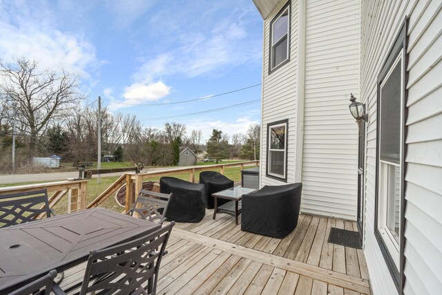 14204 Northmoor Dr, Cement City, MI 49233 - wooden deck with outdoor dining area