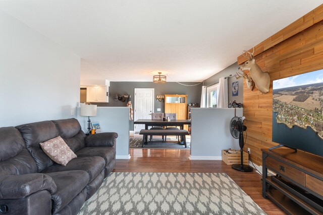 14204 Northmoor Dr, Cement City, MI 49233 - living room featuring wooden walls and wood finished floors