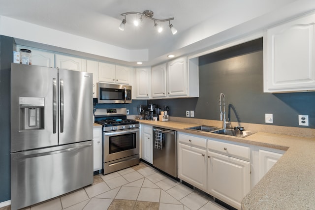 14204 Northmoor Dr, Cement City, MI 49233 - kitchen featuring light tile patterned floors, white cabinetry, appliances with stainless steel finishes, light countertops, and a sink