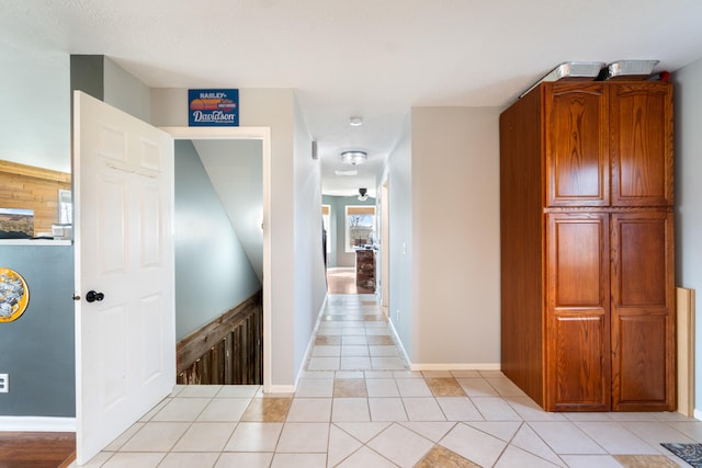 14204 Northmoor Dr, Cement City, MI 49233 - hall with light tile patterned floors and baseboards