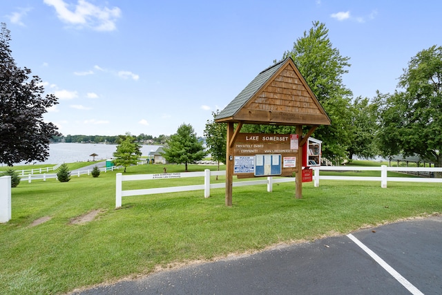 14204 Northmoor Dr, Cement City, MI 49233 - view of property's community with a water view, fence, and a lawn