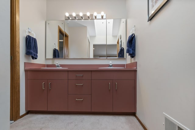 3755 Oak Dr, Ypsilanti, MI 48197 - bathroom with double vanity, visible vents, baseboards, and a sink