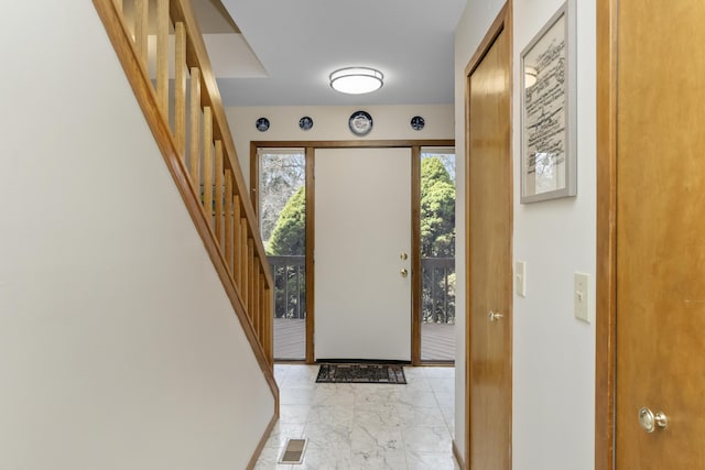 3755 Oak Dr, Ypsilanti, MI 48197 - foyer entrance with a wealth of natural light, stairway, visible vents, and marble finish floor
