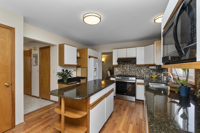 3755 Oak Dr, Ypsilanti, MI 48197 - kitchen with open shelves, stainless steel range, a sink, black microwave, and white refrigerator with ice dispenser