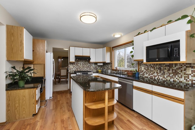 3755 Oak Dr, Ypsilanti, MI 48197 - kitchen featuring stainless steel dishwasher, stove, black microwave, open shelves, and a sink