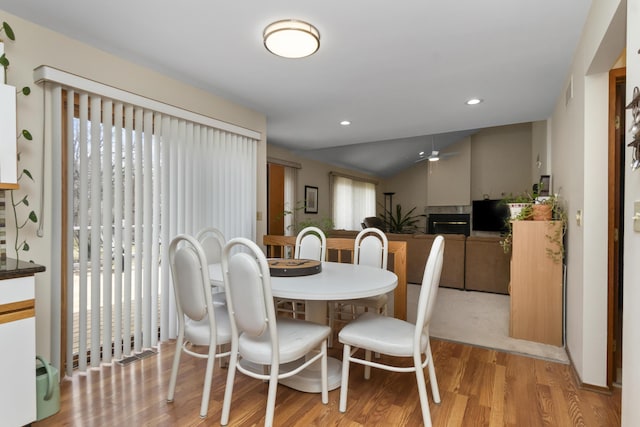 3755 Oak Dr, Ypsilanti, MI 48197 - dining room with light wood-style floors, lofted ceiling, and recessed lighting