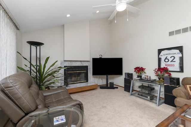 3755 Oak Dr, Ypsilanti, MI 48197 - carpeted living area with visible vents, ceiling fan, a high end fireplace, recessed lighting, and a towering ceiling