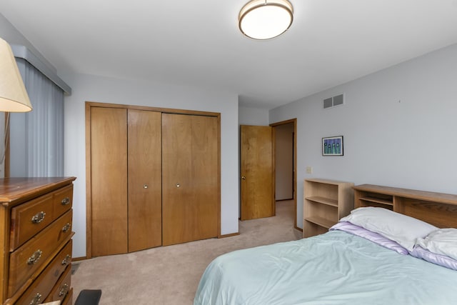 3755 Oak Dr, Ypsilanti, MI 48197 - bedroom featuring light carpet, visible vents, and a closet
