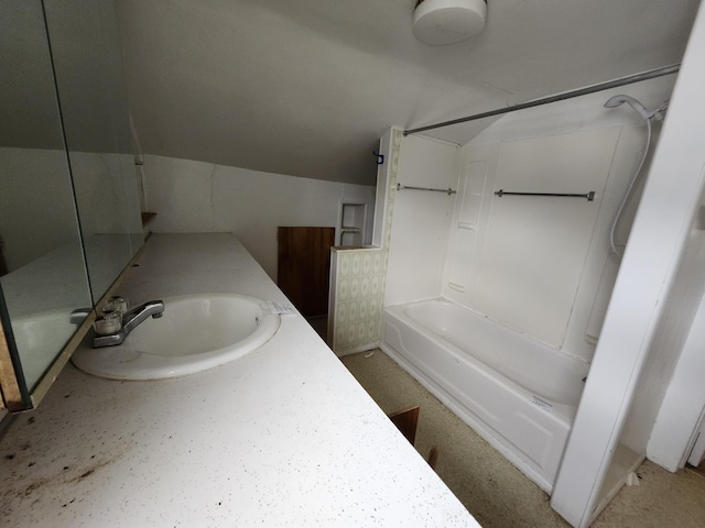 309 N Main St, Scottville, MI 49454 - bathroom featuring vanity, shower / tub combination, and vaulted ceiling