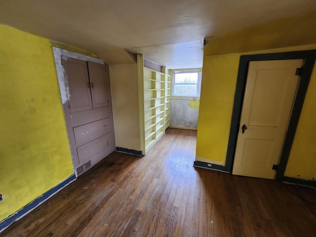 309 N Main St, Scottville, MI 49454 - additional living space with baseboards, dark wood-style floors, and visible vents