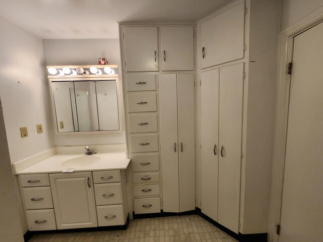 309 N Main St, Scottville, MI 49454 - bathroom featuring tile patterned floors and vanity
