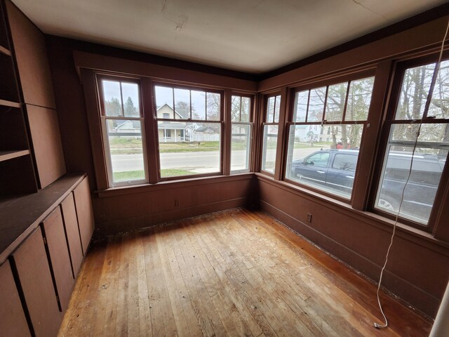309 N Main St, Scottville, MI 49454 - unfurnished sunroom featuring hardwood / wood-style flooring