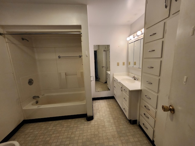 309 N Main St, Scottville, MI 49454 - full bath with tile patterned floors, shower / bathtub combination, vanity, and baseboards