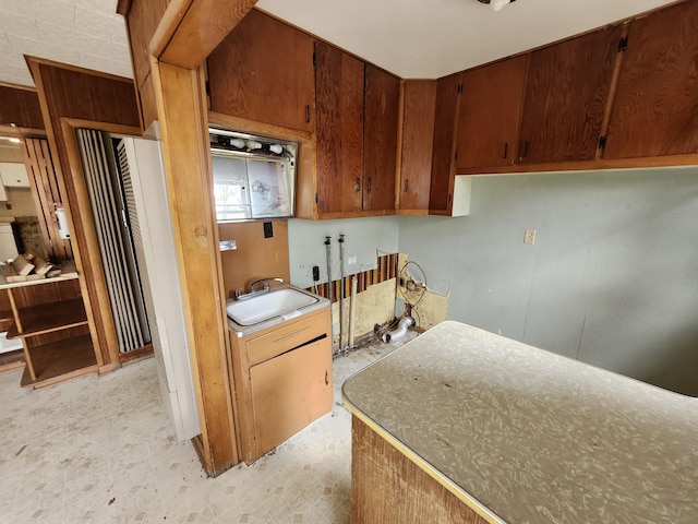 309 N Main St, Scottville, MI 49454 - kitchen featuring a sink and light floors