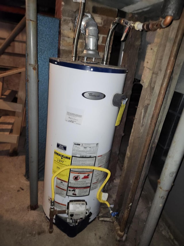 309 N Main St, Scottville, MI 49454 - utility room featuring water heater