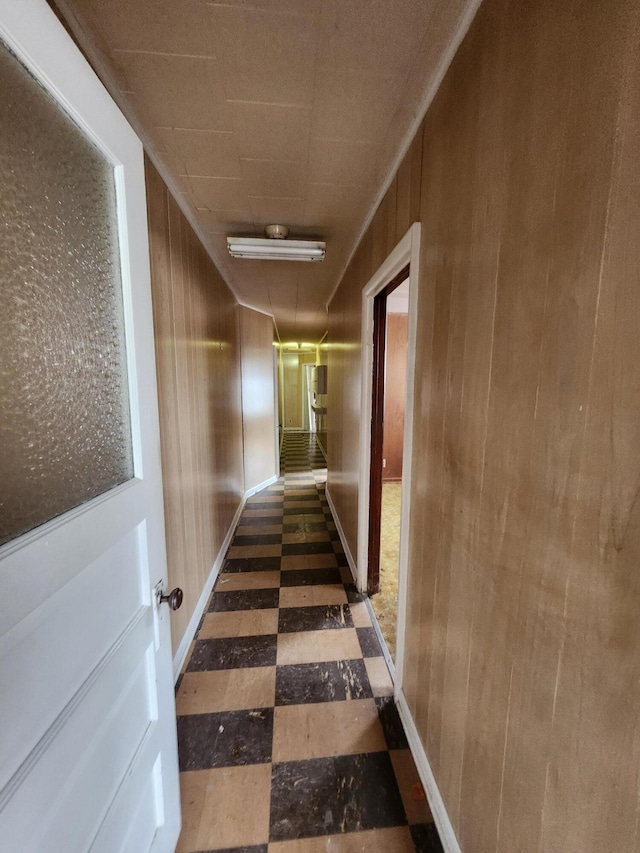 309 N Main St, Scottville, MI 49454 - hall featuring tile patterned floors and wood walls