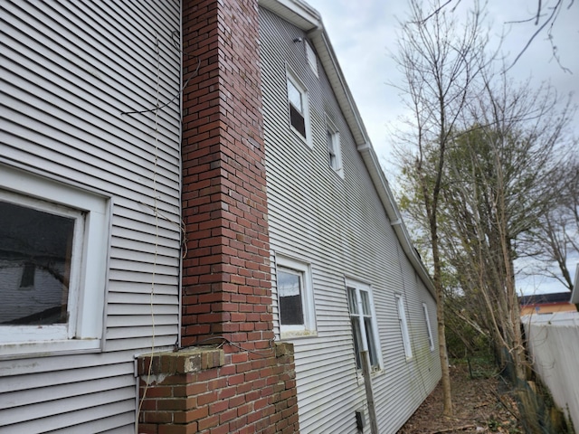 309 N Main St, Scottville, MI 49454 - view of side of home with a chimney
