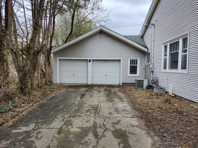 309 N Main St, Scottville, MI 49454 - view of side of property with a garage and aphalt driveway
