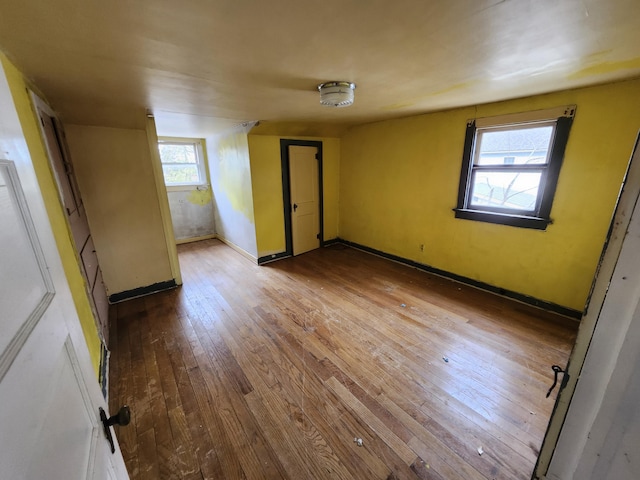 309 N Main St, Scottville, MI 49454 - unfurnished room with wood-type flooring and baseboards