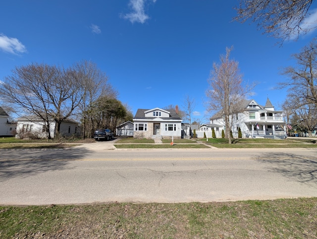 309 N Main St, Scottville, MI 49454 - view of front of home featuring a front lawn and driveway
