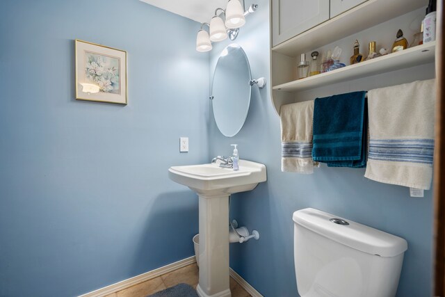 7630 Dilley Rd, Davisburg, MI 48350 - bathroom with tile patterned floors, toilet, and baseboards