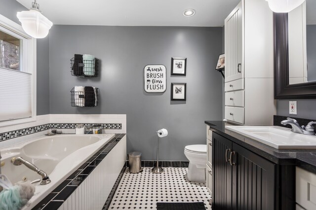 7630 Dilley Rd, Davisburg, MI 48350 - full bathroom featuring a tub with jets, toilet, vanity, recessed lighting, and baseboards
