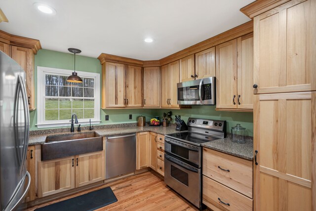 7630 Dilley Rd, Davisburg, MI 48350 - kitchen with stainless steel appliances, a sink, light brown cabinets, light wood finished floors, and recessed lighting